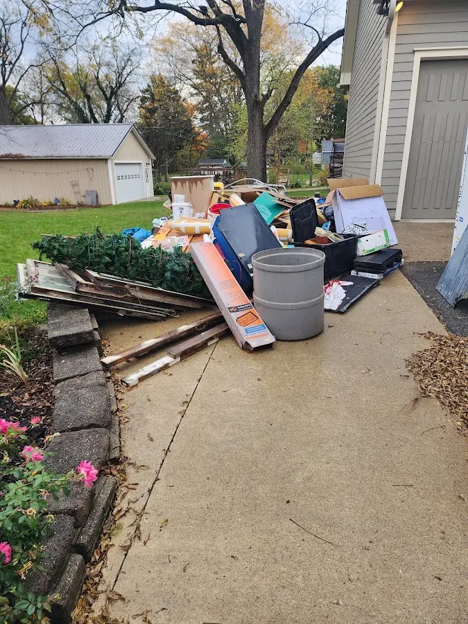 Dumpster being loaded with debris for 30 Yard Dumpster Rental in Galesburg